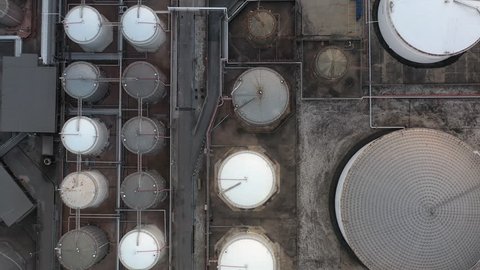 Liquid chemical tank terminal, Storage of liquid petrol fuel chemical and petrochemical product tank, Aerial view crude oil and gas terminal port, Business power and energy chemical industry factory.
