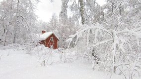 A red cottage in the forest in full winter weather - Powered by Shutterstock - Get 15% off with code: PIKWIZARD15