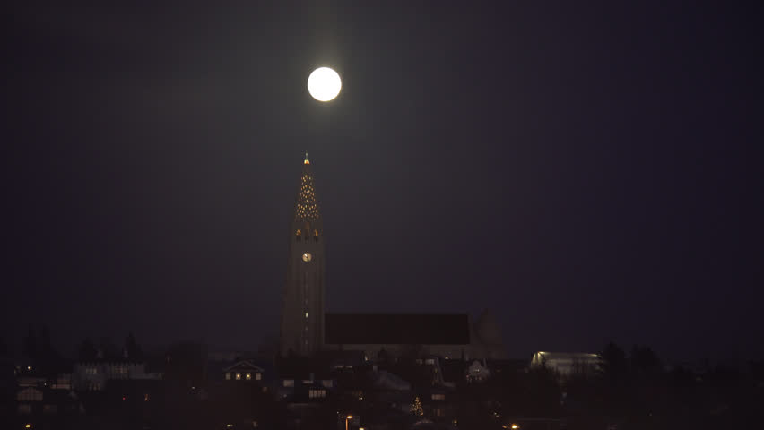 Bright full moon and fog over Halgrimskirkja church, Reykjavik Iceland.mov
