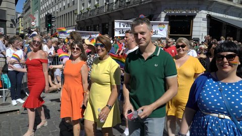 OSLO, NORWAY - JUNE 30, 2018: Huge costume crowd sings and dances. The Pride Parade, the highlight of Oslo’s Pride Week, is a huge, vibrant parade filling the city’s streets.