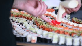 Chef making sushi rolls during a sushi culinary workshop