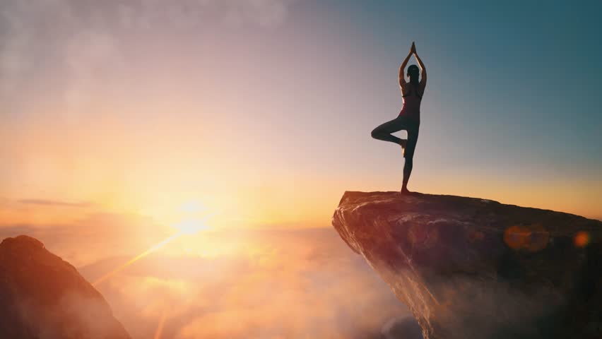 woman practices yoga meditates on mountain Stock Footage Video (100% ...