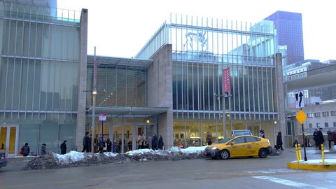CHICAGO, IL - FEBRUARY 2, 2019 - Entrance to The Art Institute of Chicago on a cold winter day, with people going in and out and cars moving on the streets