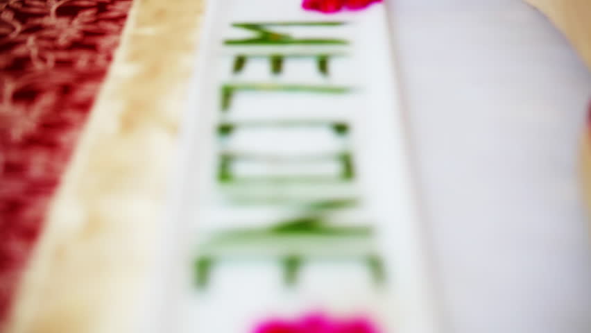 Welcome word on a bed of tropical hotel. FullHD stock footage