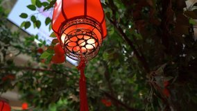 Slowmotion closeup of red chinese lanterns. Lunar new year concept. Chinese new year concept - Powered by Shutterstock - Get 15% off with code: PIKWIZARD15