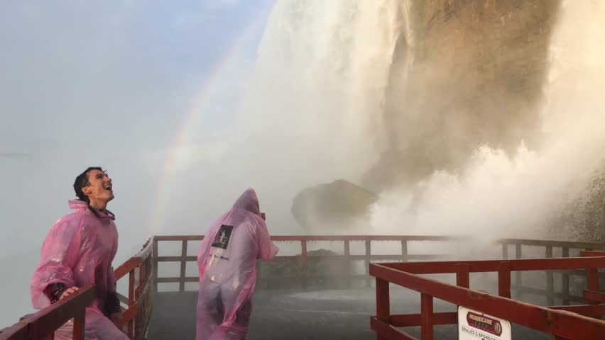 Excited Couple Under Rainbow at Niagara Falls, Waterfall