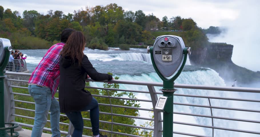 Couple with Viewfinder Looking at Niagara Falls, Tourists