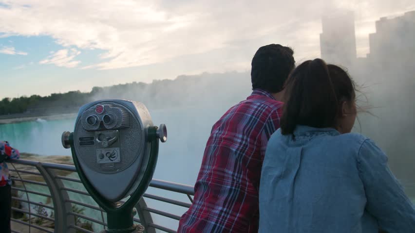 Couple on Bridge Looking at Niagara Falls, Beautiful View