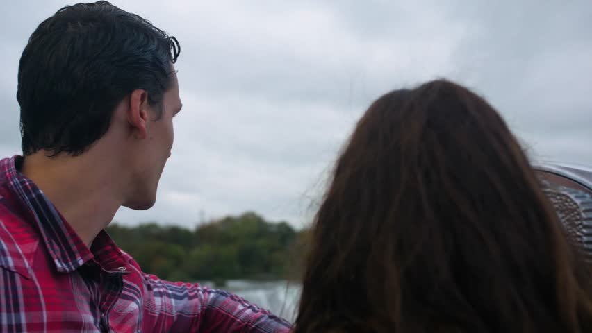 Couple on Bridge Looking at Niagara Falls, Tourists Viewfinder