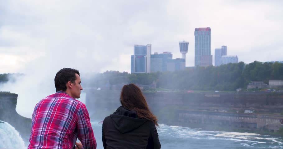 Couple on Bridge Looking at Niagara Falls, Tourists Viewfinder