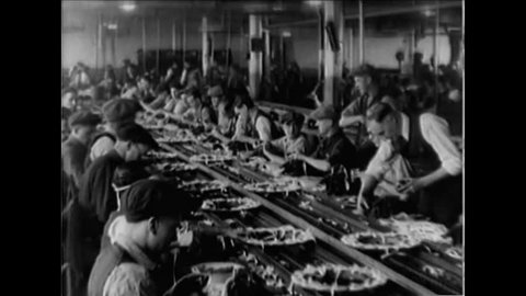 CIRCA 1920s - Good assembly line Ford factory footage with workers from the 1920s.