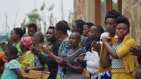 Rubuguri, Uganda - January, 2018: Group of African women singing and clapping.