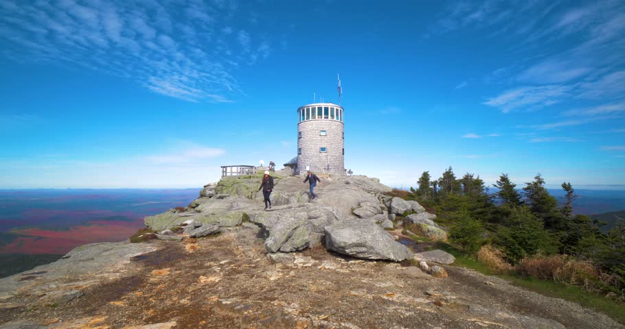 Hiking Couple Exploring Peak of Mountain, Lake Placid NY
