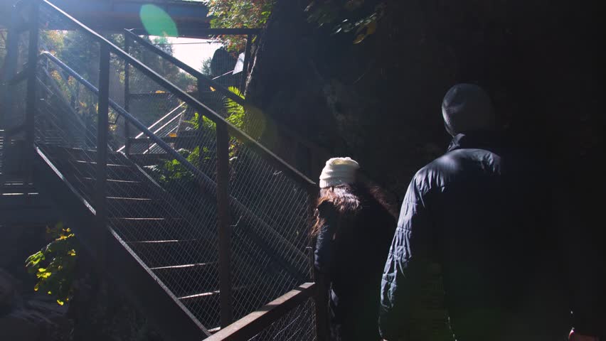 Couple Climbs Steps in Beautiful Mountain State Park