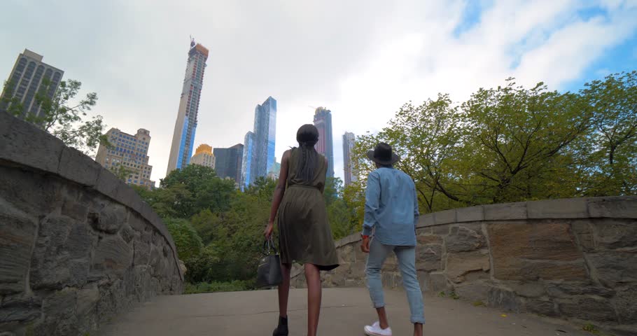 Young Couple Walks Through Central Park, Skyline, Diverse New York NYC Royalty-Free Stock Footage #1023776548