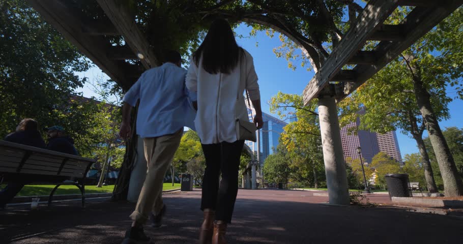 People Walking Through Arch in Columbus Park, Downtown Bostom