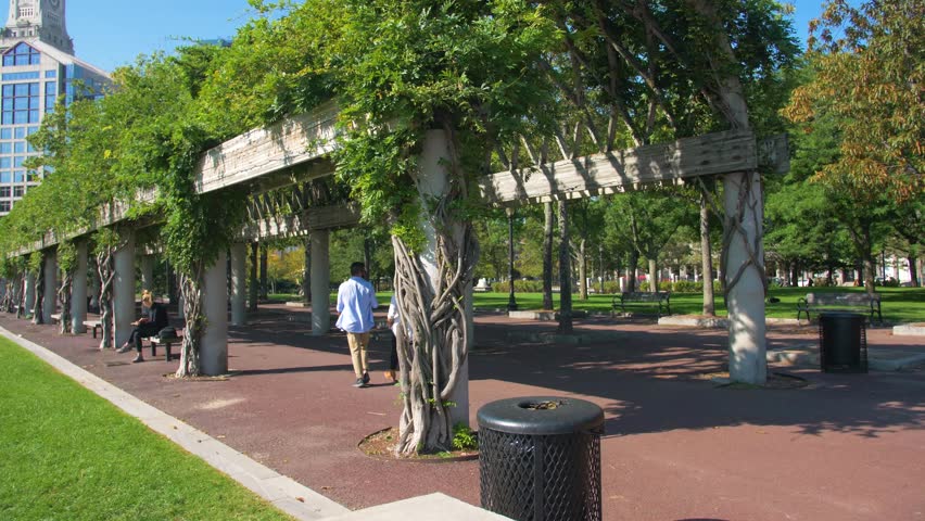 People Walking Through Arch in Columbus Park, Downtown Bostom