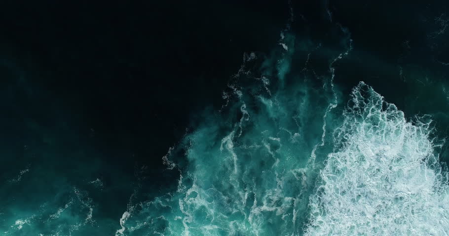 Top down aerial view of giant ocean waves crashing and foaming Royalty-Free Stock Footage #1023786100