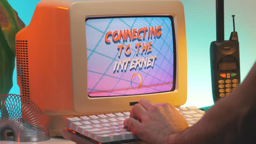 Waiting for the vintage computer to connect to the Internet. 80s 90s style concept.