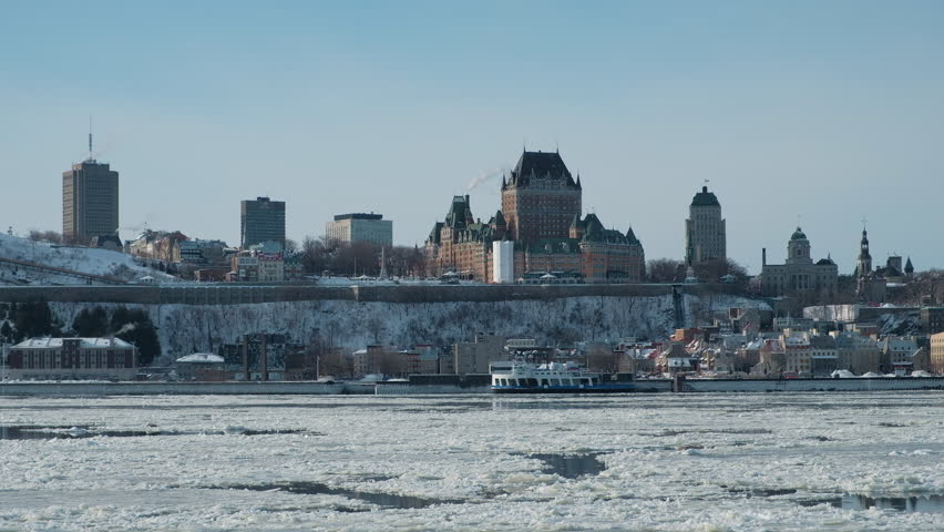 Scenic view of old castle on hill in sunset light in capital of Quebec province in Canada. Depressive beautiful winter look of historical building in Quebec city