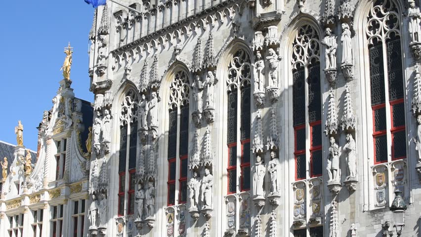 Decorated facades of the Bruges City Hall and Civiele Griffie / old civil registrar at the Burg, Brugge, Flanders, Belgium, Tilt up