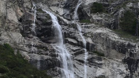 Waterfall in the Mount Blanc massif seen from the Val Veny valley, Graian Alps, Italy