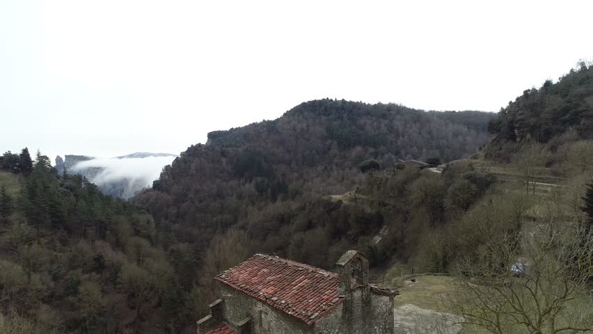 4K drone footage of small Baroque chapel of the 17th century in a mountain village of Catalonia
