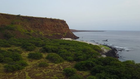 Drone flying over cliffs and beach hawaii