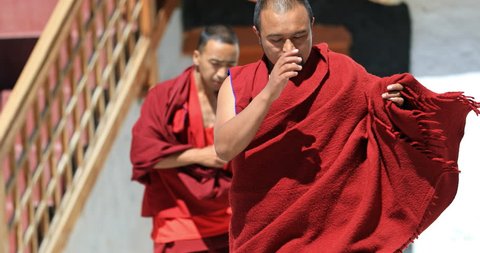 LADAKH, INDIA 18 SEP 2017: Traditional religious dance by two Buddhist monks in red dresses, Ladakh, Himalaya