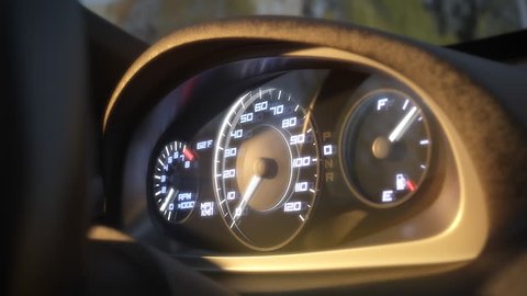 Dashboard in the car. Speedometer and moving,featuring lights leaks. 3d rendering, animation.