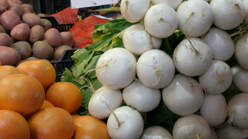 Various vegetables on the counter of the grocery market. Healthy food, fiber, diet, inscription in Hungarian
