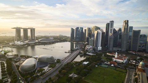 4k aerial time lapse of cloudscape at Singapore city skyline. Pan left