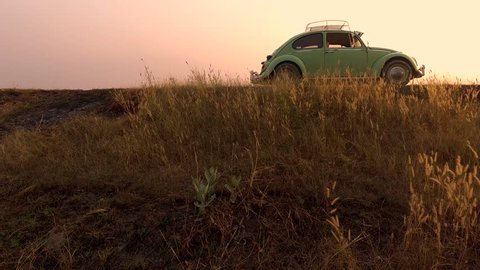 CHAIYAPHUM, THAILAND - FEBRUARY 10: 4K video classic volkswagen beetle car at sunset time on the february 10, 2019 in Chaiyaphum Thailand