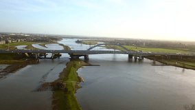 Stock aerial video of the bridge over the river in the Netherlands