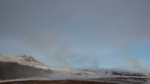4K Time lapse zoom out of two eruptions of the biggest active geysir in Iceland, Strokkur, in the Golden circle in wintertime