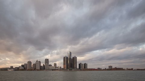 DETROIT, USA - NOV 07, 2013: 4K Time lapse wide angle of Detroit city waterfront and skyline at sunset in twilight with clouds passing by
