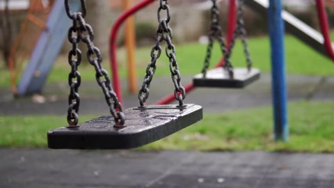 Cinematic Empty Swings In Playground, Child Abduction Concept 