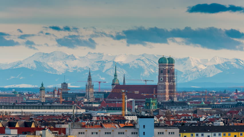 Panorama munich city, germany skyline aerial view in background alps in winter with snow time lapse. Royalty-Free Stock Footage #1023871192