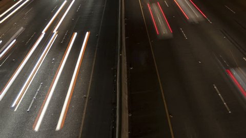 Time lapse close up night motion light trails on a busy Los Angeles freeway