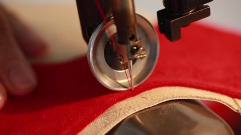 closeup of sewing machine, sew leather for shoe parts before assembly,  making shoes workshop by handmade artisan, expert in manufacturing leather shoe, manufacture traditional shoemaker craftsman