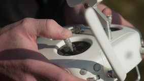 Male hands control quadrocopter. 4k