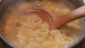 Pasta cooked in boiling water in the kitchen