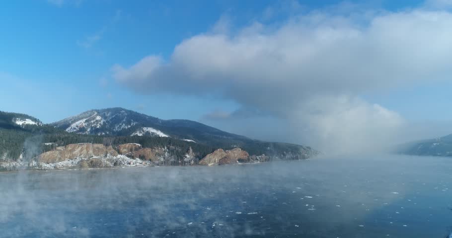 Winter river in fog, mountain, forest | Shutterstock HD Video #1023898894