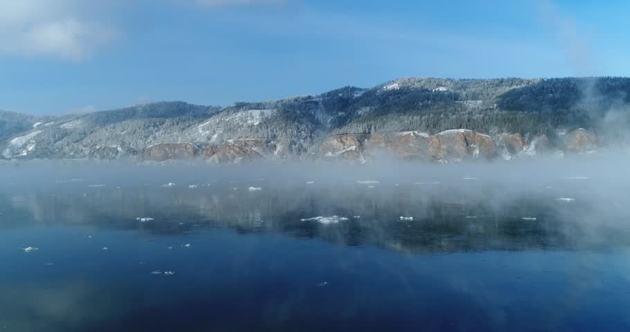 Winter river in fog, mountain, forest | Shutterstock HD Video #1023898915