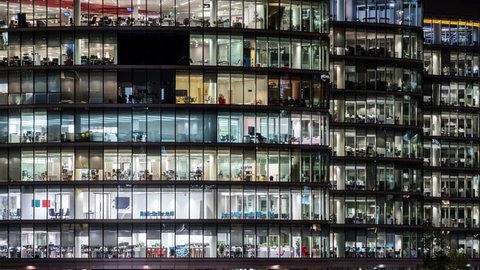Night time Close up View Office Windows Business Center London City UK Time lapse