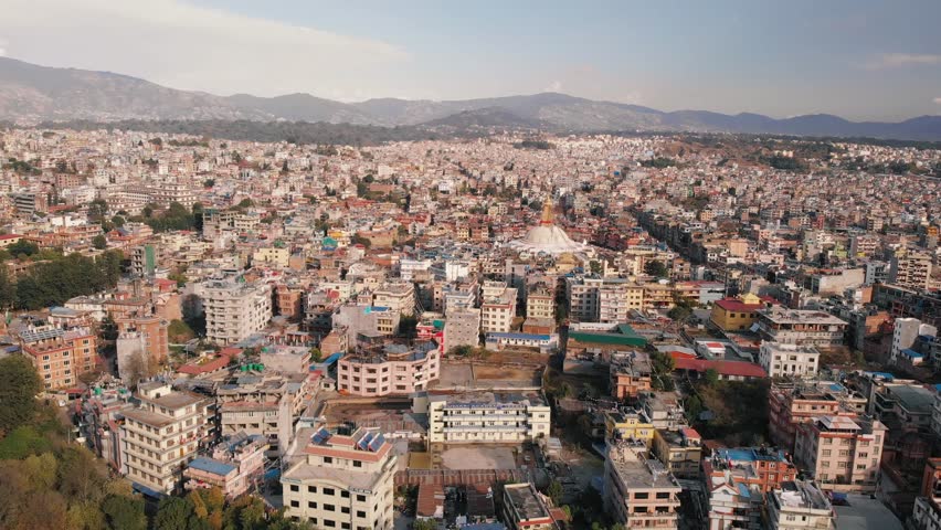 Aerial view on houses of Kathmandu, Nepal. Aerial view of white Boudhanath stupa.