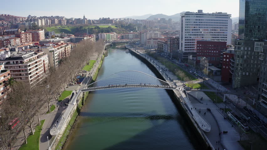 Aerial; drone view of Bilbao capital of Basque country; city panorama with modern architecture and contemporary art objects; new life of ancient city; the combination of old town and modern urbanism Royalty-Free Stock Footage #1023911635