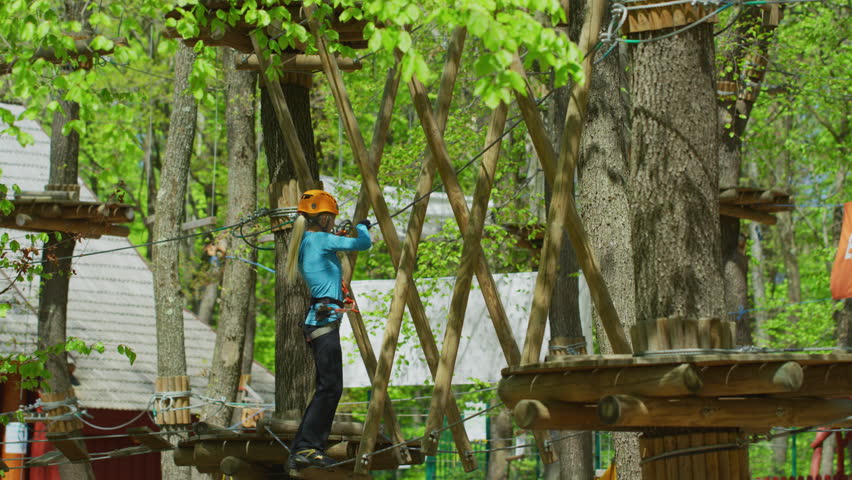 Young woman in an adventure park.
