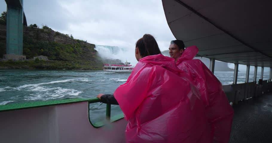 Young Couple on Boat at Niagara Falls, Tour Excursion Waterfalls