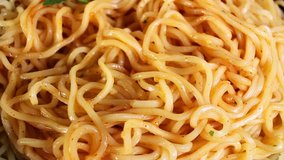 Instant pasta noodles fast food closeup texture pattern seamless looping rotating video footage hd resolution.